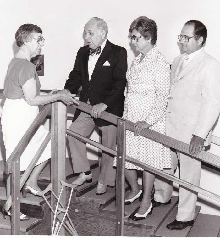 August 16, 1985. "Evelyn Barnes, R.N., left, director of the Somerset Crippled Children's Treatment Center, Bridgewater, explains uses for a set of steps in the therapy room to (Left to right) Freeholder Vernon Noble, county human services chairman; Edith Regan, R.N., coordinator of community-based services for the N.J. Department of Health, special child health services; and John A. Koopman, chairman of the center board of directors. The treatment center, a nonprofit organization run by Elks lodges, hosts the Somerset County Special Child Health Services Case management Unit."